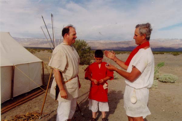 Centurio Marcus doing the honors of presenting Titus Aedred his Caesar medallion.  His son, Severius, is witness of this proud occation.