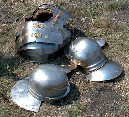 Armour used by Legio X members. The cuirass is a Corbridge Type B segmented Lorica with hooks holding the upper portion to the torso. The helmets are both of similar construction and are of the Coolus type.