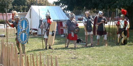 In this frontal view, seeral of our shields are clearly visible.  Centurio Marcus nd Optio Antony Lucius each hold a Republican era scutum.  Flavius Vespasianus holds a small round parma type with a beautifully painted scene.   